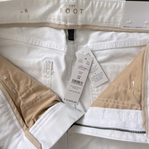 White House Black Market white boot cut jeans with stretch.